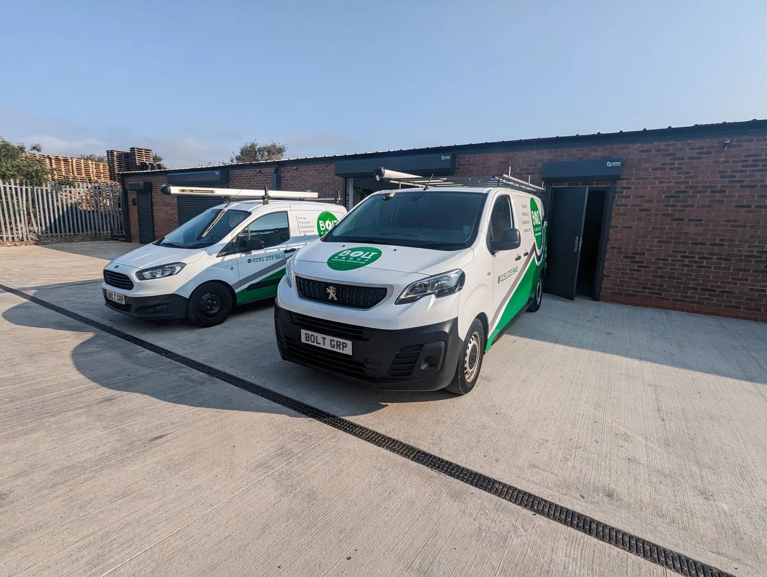 Bolt Group liveried vans outside the company's unit at Conway Point, Birkenhead