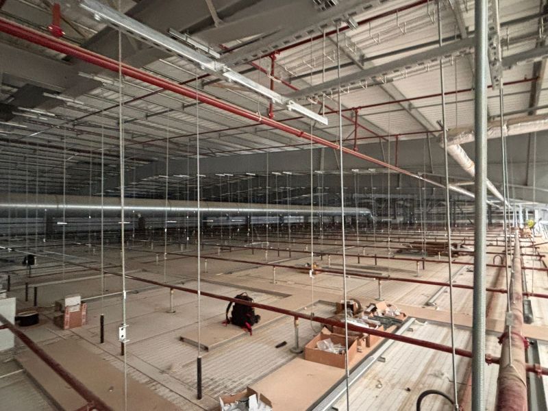 High-level containment, pipework and suspension wires above a raised deck